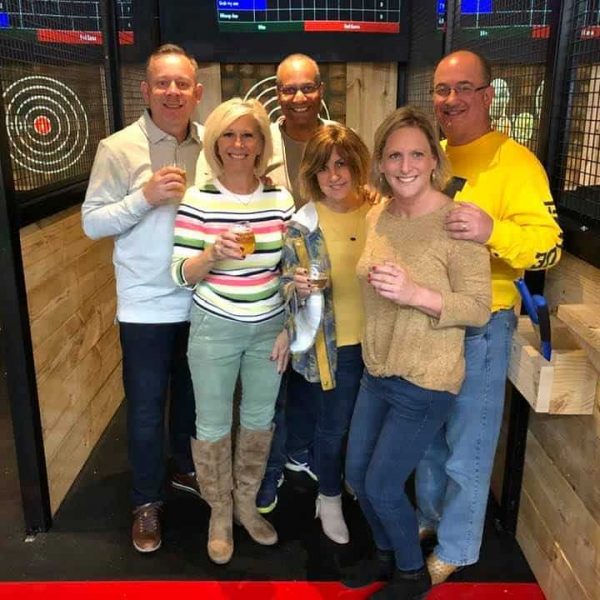 couples at axe throwing party